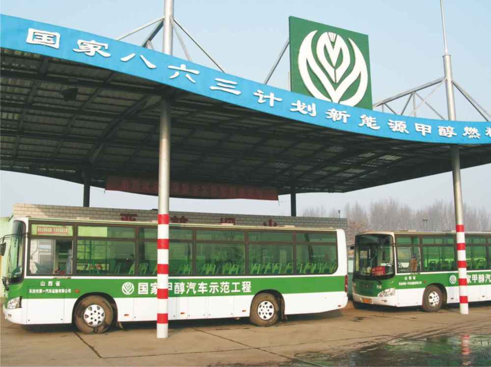 A photograph of two buses in China with diesel engines, refuelling with pure methanol