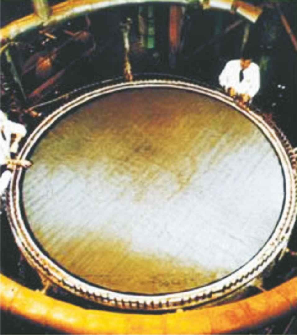 A photograph of a very large piece of gauze of a platinum-rhodium alloy installed in a converter